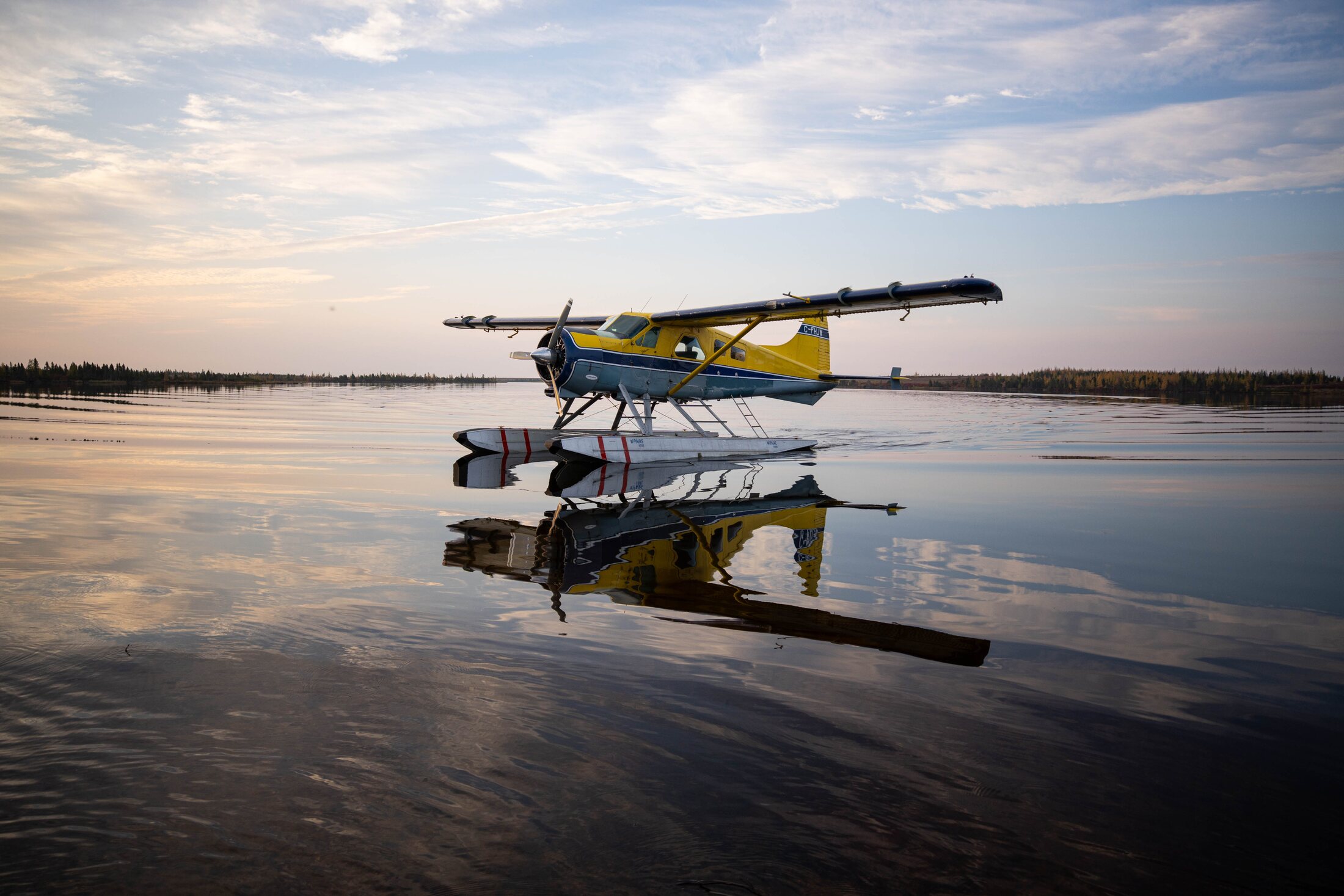 Pelican aircraft on the water at sunset